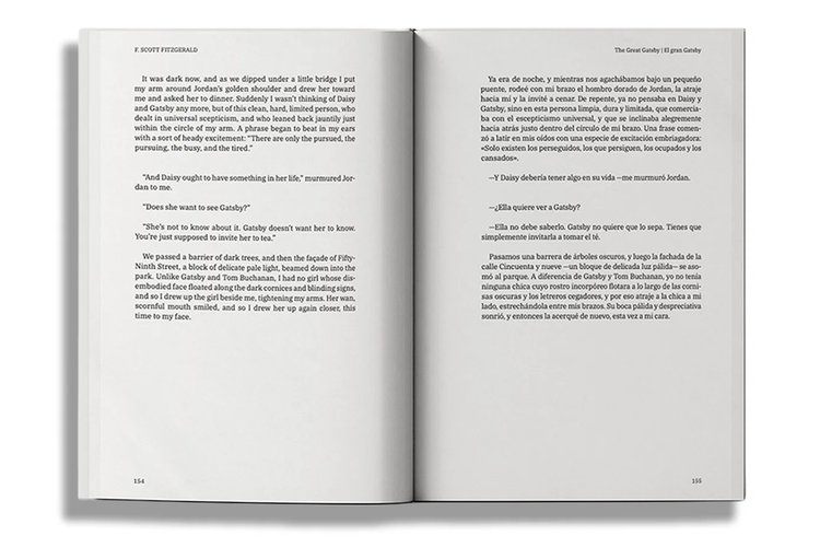 Open bilingual Spanish-English parallel text book showing both languages side by side